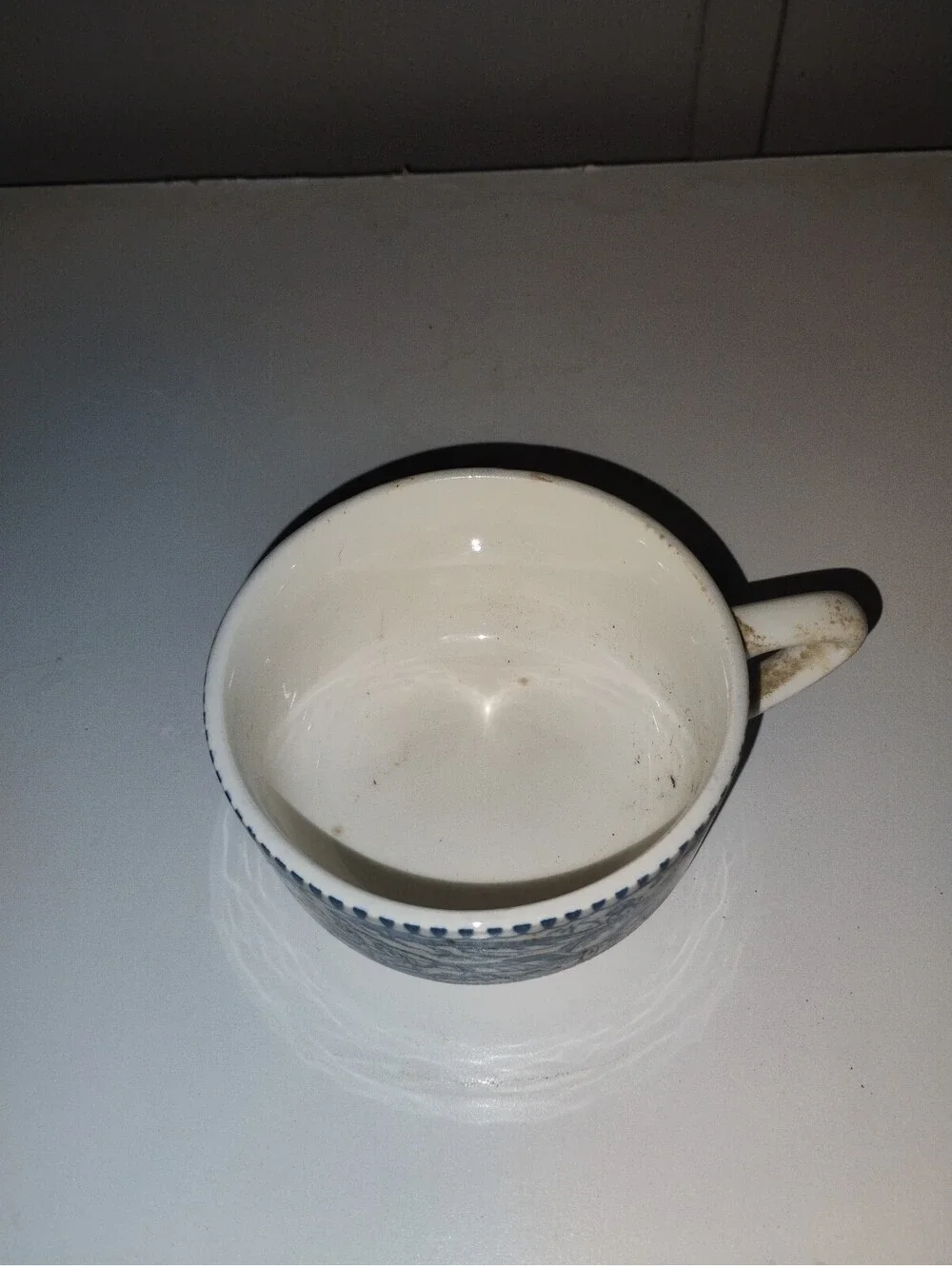 Vintage Blue and White Ceramic Cup with Horse and Carriage Design